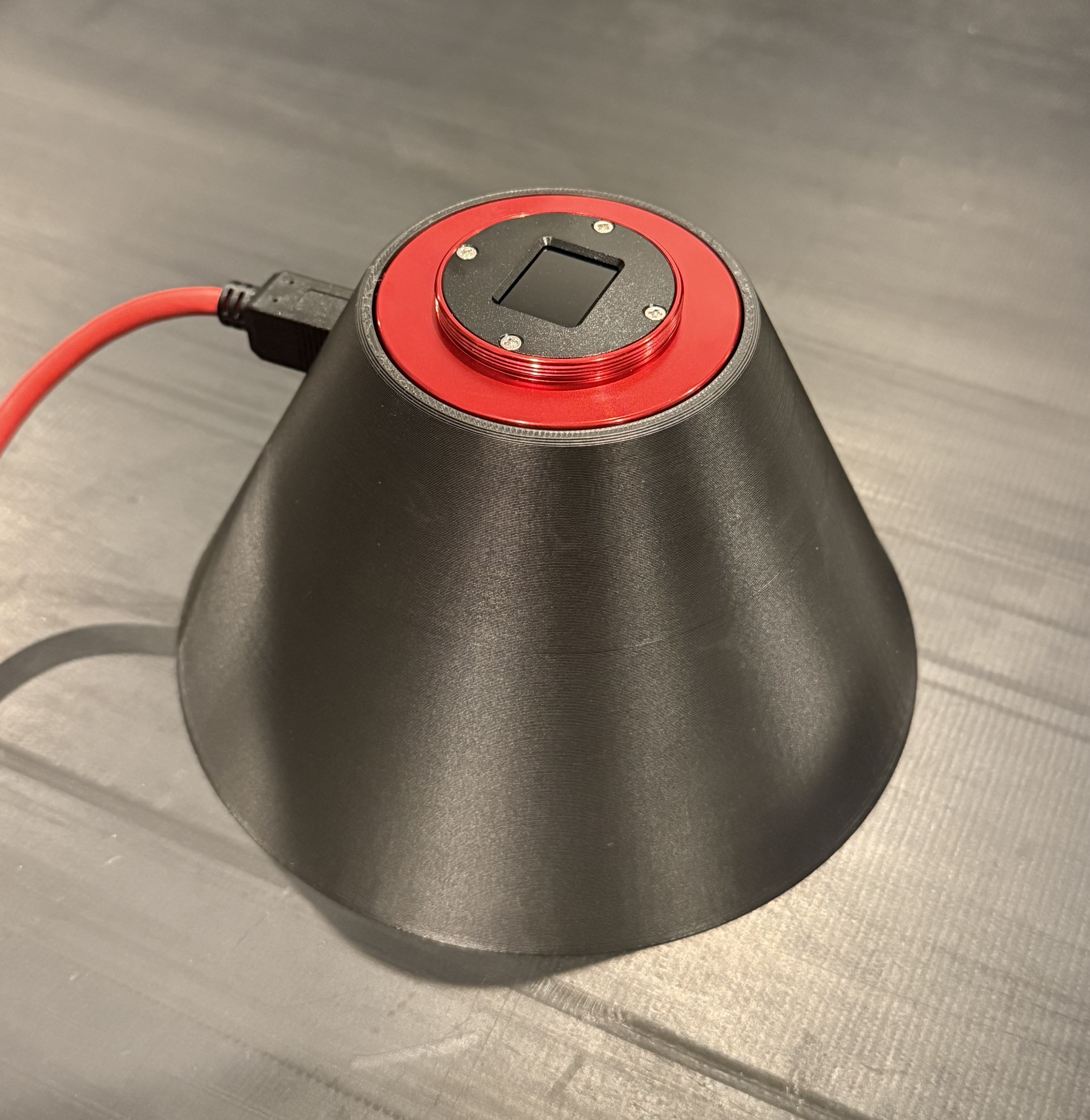 Calibration assembly - A cone, so that 2D height profiler measurements (hyperbolae) can be related back to its mounting pitch and roll.